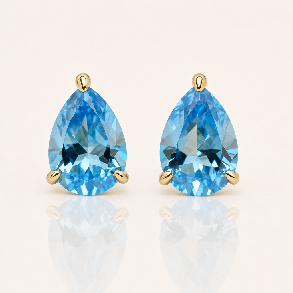 Swiss Blue Topaz Pear Stud Earrings | 9ct Yellow Gold