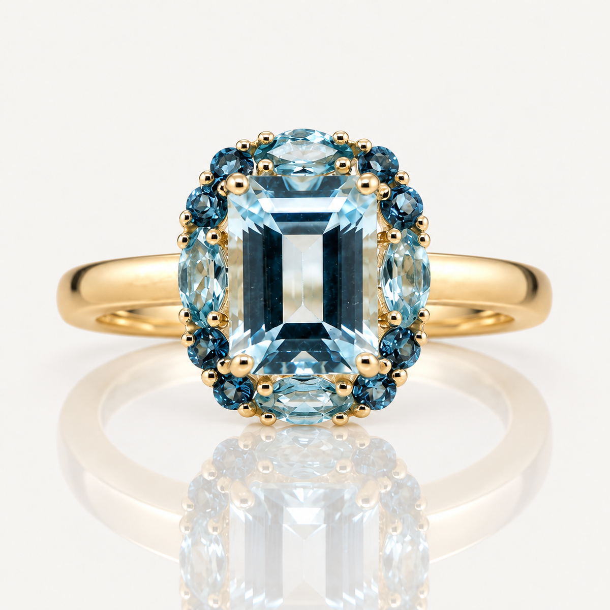 9ct YG Blue Topaz with Sky Blue & London Blue Halo Ring