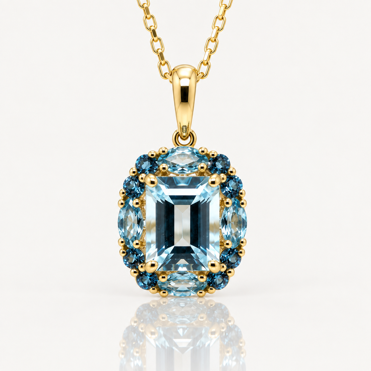 Blue Topaz Halo Pendant | Swiss & London Blue | 9ct Yellow Gold