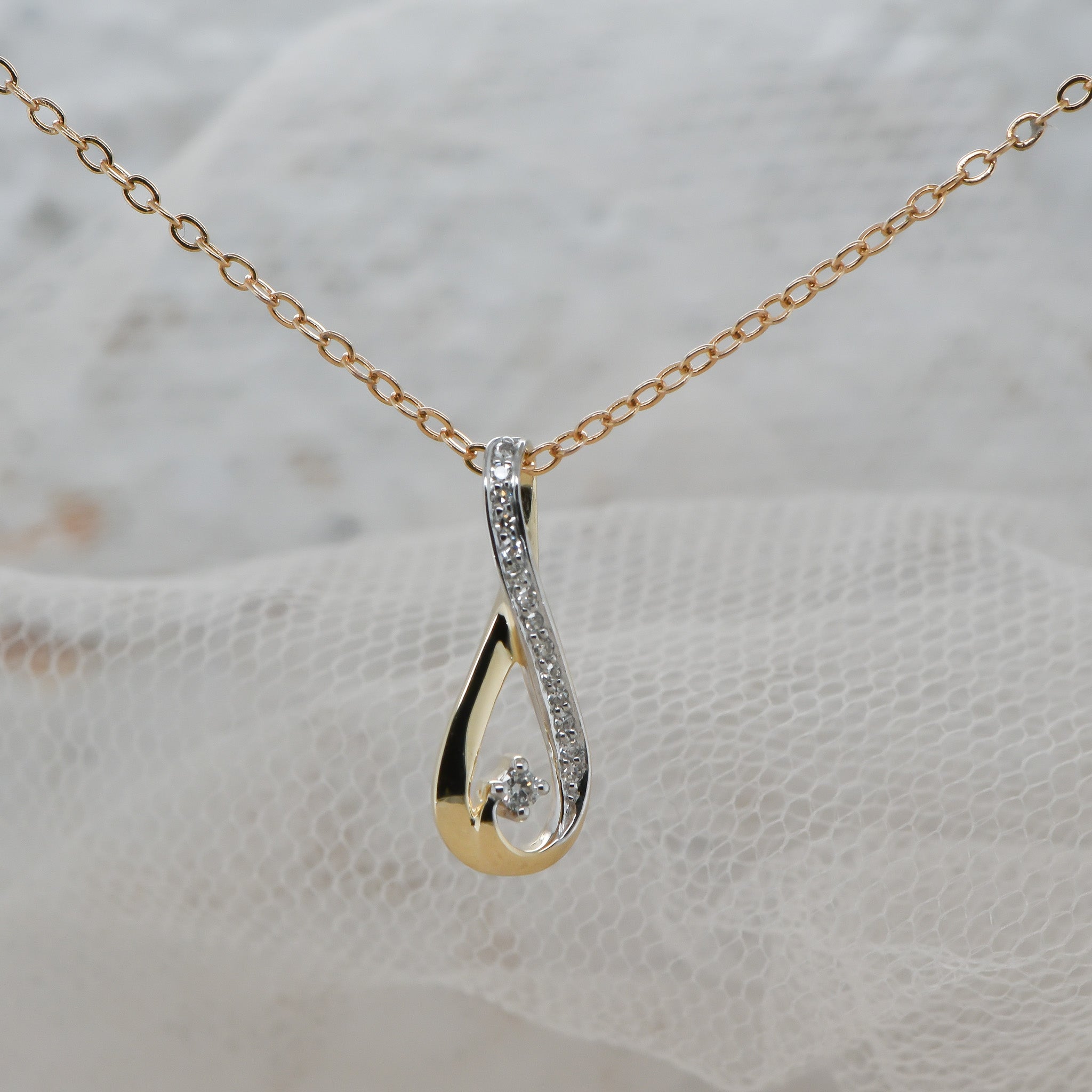 Diamond set infinity pendant