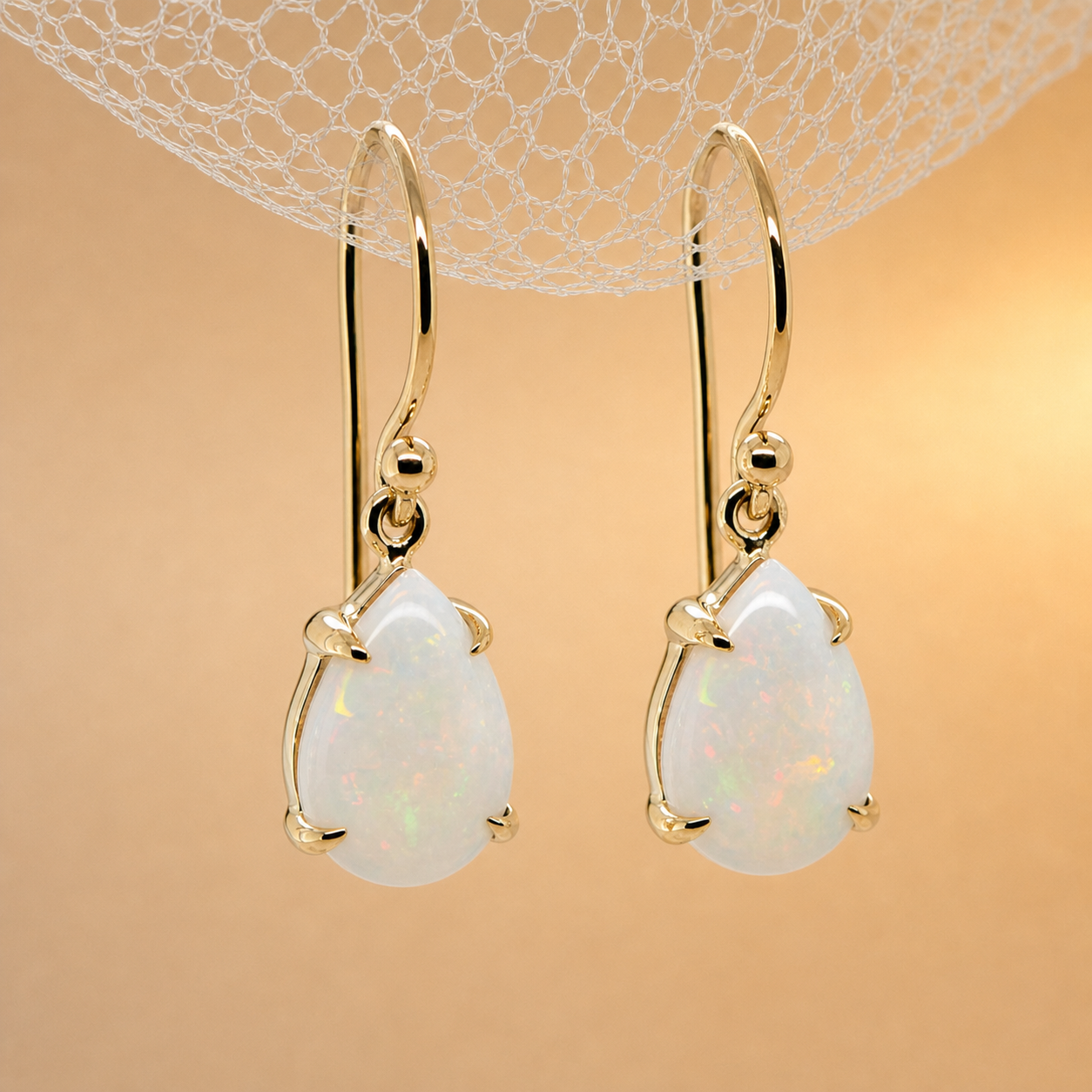 Pear cut white opal drop earrings
